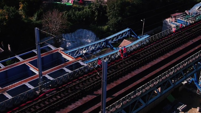 Video Reference: Rolling stock, Vehicle, Building, Track, Railway, Railroad car, Tree, Rolling, Urban design, Locomotive