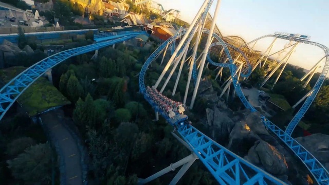 Video Reference: Sky, Tree, Leisure, Recreation, Amusement ride, Landmark, Fun, City, Roller coaster, Landscape
