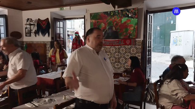Video Reference: restaurant, indoor, people, dining, cafe, group, standing, seated, doorway, interior, casual, social, tableware, crowd