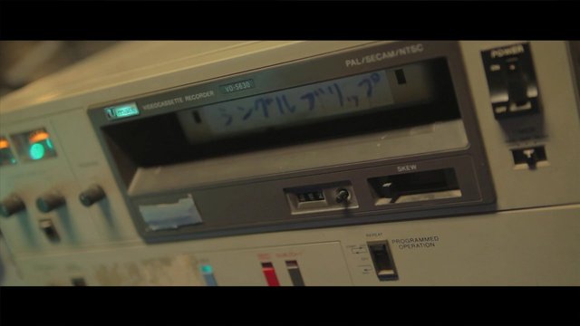 Video Reference: vhs, videocassette, recorder, vcr, retro, vintage, electronic device, close-up, front panel, buttons, display, analog, media player, old technology