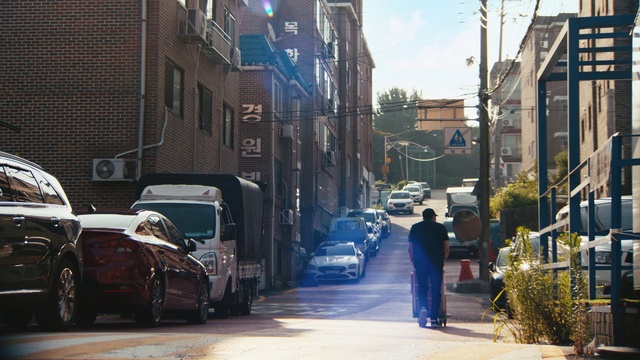 Video Reference: Tire, Car, Wheel, Plant, Building, Vehicle, Window, Infrastructure, Automotive lighting, Sky