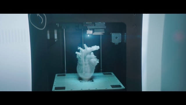 Video Reference: Jaw, Gesture, Art, Television set, Sculpture, Display device, Multimedia, Glass, Electric blue, Gadget