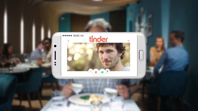Video Reference: smartphone, dating app, profile, restaurant, blurred background, social app, mobile screen, online dating, man portrait, lifestyle, technology, indoor, dining, advertising