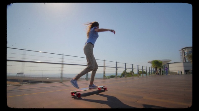 Video Reference: Sky, Sports equipment, Skateboard deck, Skateboarder, Skateboard truck, Flash photography, Skateboard, Outdoor recreation, Rolling, Plant
