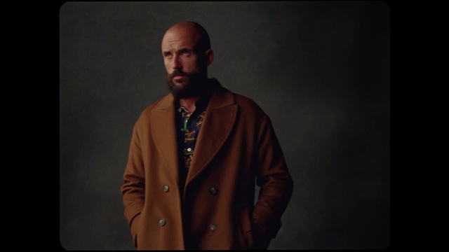 Video Reference: Chin, Neck, Beard, Sleeve, Gesture, Collar, Dress shirt, Audio equipment, Entertainment, Facial hair