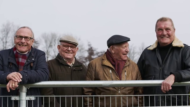 Video Reference: Smile, Outerwear, Vertebrate, Fence, Sleeve, Coat, Cap, Mammal, Headgear, Hat