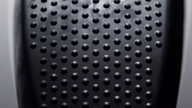 Video Reference: close-up, texture, metal, perforated, pattern, surface, abstract, dark, industrial, macro, dots, bumps, material, geometric