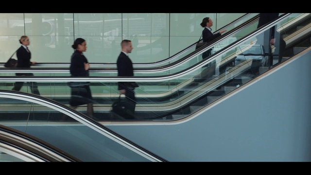 Video Reference: Escalator, Automotive design, Mode of transport, Motor vehicle, Automotive exterior, Glass, Vehicle door, White-collar worker, Automotive window part, Windshield
