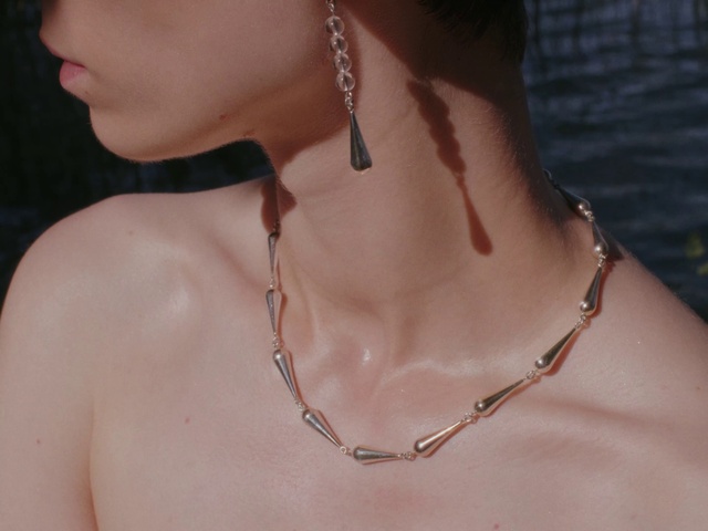 Video Reference: Shoulder, Muscle, Neck, Human body, Eyelash, Chest, Body jewelry, Natural material, Sunglasses, Jewellery