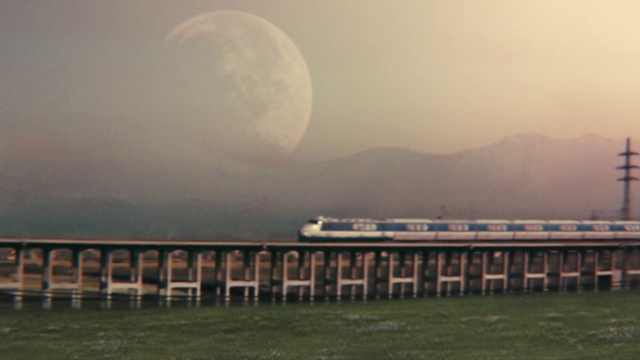Video Reference: Train, Sky, Cloud, Atmosphere, Moon, Water, Light, Vehicle, Atmospheric phenomenon, Rolling stock