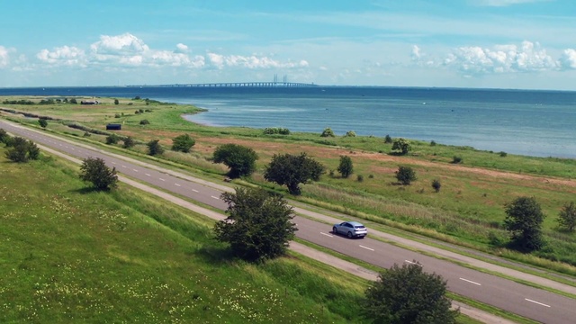 Video Reference: Water, Cloud, Sky, Plant, Ecoregion, Car, Vehicle, Infrastructure, Natural environment, Tree