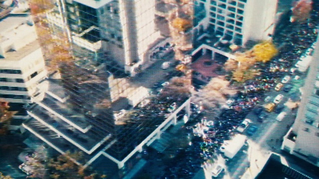 Video Reference: Daytime, World, Gesture, Font, Sky, Urban design, City, Art, Tints and shades, Pattern