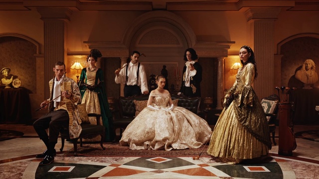 Video Reference: Gown, Performing arts, Entertainment, Dress, Wedding dress, Fashion design, Flash photography, Formal wear, Bridal clothing, Suit