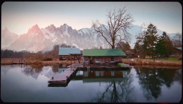 Video Reference: Water, Sky, Building, Natural landscape, Plant, Mountain, House, Tree, Lake, Atmospheric phenomenon