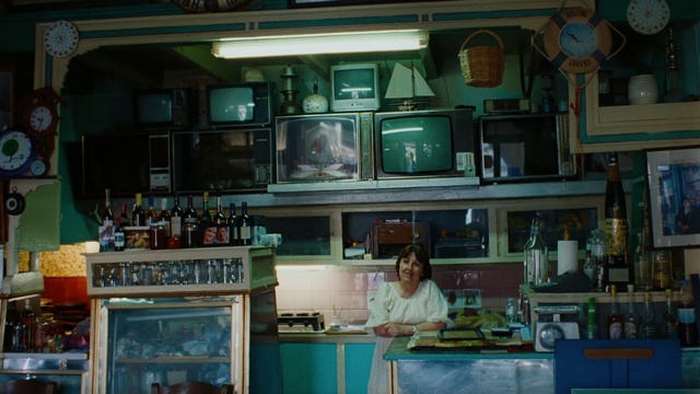 Video Reference: Drinkware, Barware, Bottle, Building, Shelving, Shelf, Drinking establishment, Countertop, Home appliance, Picture frame