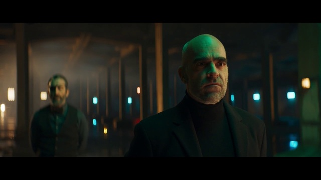 Video Reference: Event, Darkness, Electric blue, Night, Art, Visual arts, Suit, Room