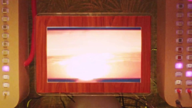 Video Reference: Rectangle, Television, Computer, Wood, Personal computer, Output device, Computer monitor accessory, Red, Flat panel display, Display device