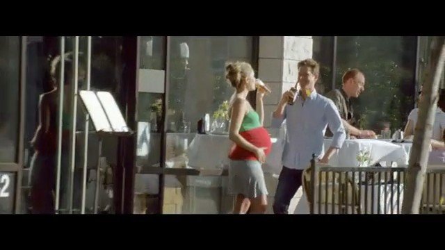 Video Reference: outdoor dining, restaurant, cafe, people, standing, drinking, bottles, tables, patio, daylight, urban, casual, socializing