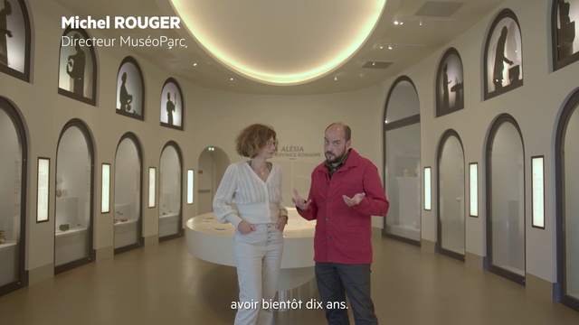 Video Reference: Interior design, Fashion, Sleeve, Architecture, Event, Ceiling, Building, Room, Exhibition, T-shirt