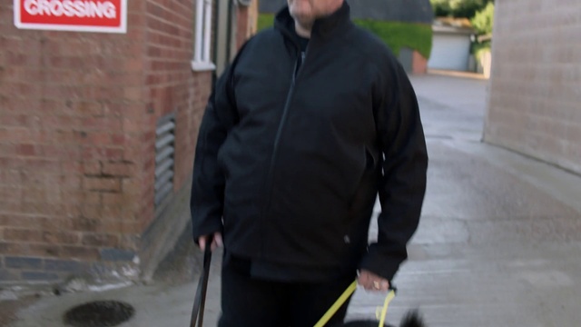 Video Reference: Outerwear, Shoulder, Sleeve, Standing, Street fashion, Dress shirt, Waist, Grey, Collar, Beard