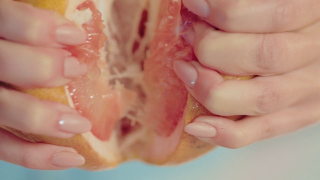 Video Reference: Hand, Food, Jaw, Animal product, Finger, Gesture, Ingredient, Thumb, Pink, Cuisine