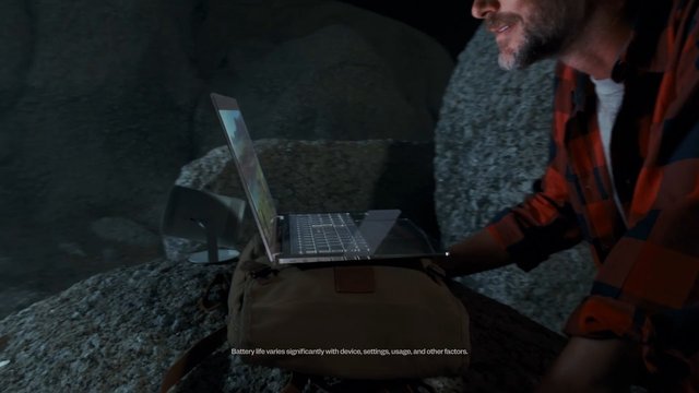 Video Reference: man, laptop, outdoor, night, backpack, speaker, technology, plaid shirt, working, portable computer, camping, remote work