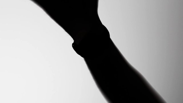 Video Reference: silhouette, arm, hand, close-up, human, black and white, abstract, background, cropped, gesture, minimal, shadow, contrast, side view