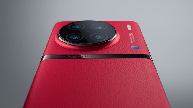 Video Reference: smartphone, mobile phone, product shot, close-up, red phone, camera module, electronics, tech, rear view, studio background, luxury design, texture, device, telephoto