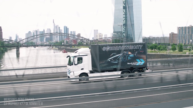 Video Reference: Wheel, Tire, Building, Motor vehicle, Vehicle, Truck, Sky, Car, Asphalt, Skyscraper