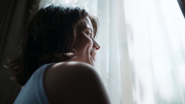 Video Reference: Shoulder, Smile, Eyelash, Flash photography, Window, Happy, Curtain, Darkness, Fun, Window treatment