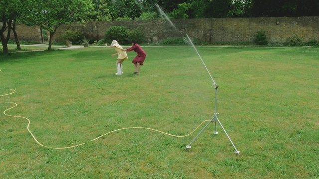 Video Reference: Plant, Playing sports, Hoop (rhythmic gymnastics), Tree, Grass, People in nature, Grassland, Recreation, Grass family, Lawn
