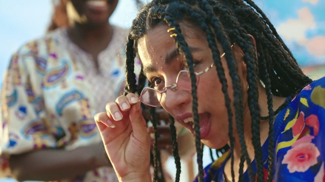 Video Reference: Cornrows, Vision care, Eyewear, Happy, Gesture, Dreadlocks, Audio equipment, Adaptation, Necklace, Earrings