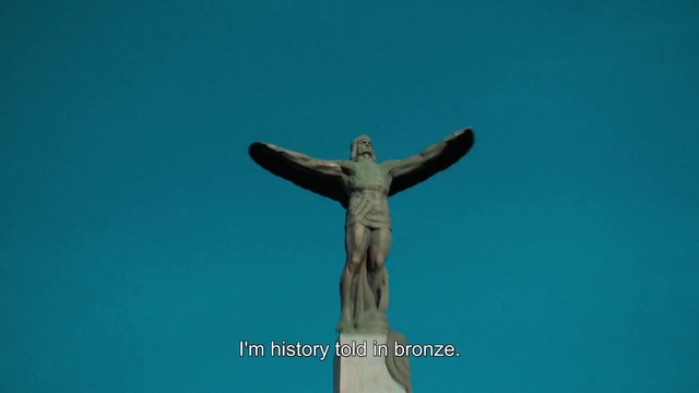 Video Reference: Sky, Human body, Sculpture, Statue, Cross, Gesture, Art, Religious item, Artifact, Monument
