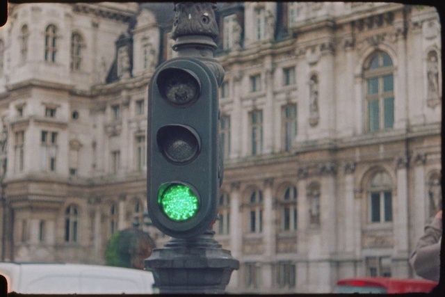 Video Reference: Building, Window, Traffic light, Facade, City, Snapshot, signaling device, Font, Fixture, Electric blue