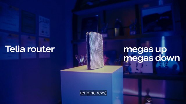 Video Reference: router, device, product shot, blue lighting, pedestal, studio, advertisement, text overlay, technology, indoor, display, modern, close-up