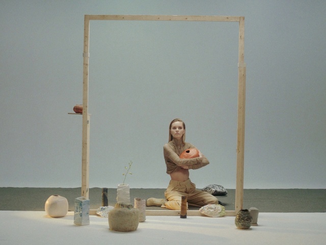 Video Reference: Hand, Musical instrument, Human body, Wood, Art, Sculpture, Statue, Balance, Visual arts, Sitting