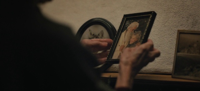 Video Reference: Hand, Picture frame, Human body, Gesture, Wood, Wrist, Art, Eyelash, Flash photography, Darkness