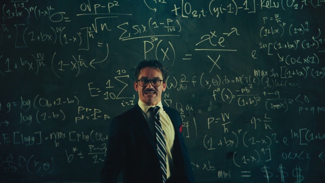 Video Reference: Clothing, Handwriting, Vision care, Human, Black, Tie, Organism, Font, Blackboard, Line