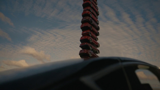 Video Reference: Cloud, Sky, Automotive tire, Plant, Tower, Building, Gas, Tints and shades, Roof, Tree