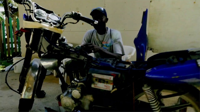 Video Reference: Motor vehicle, Automotive design, Automotive tire, Motorcycle, Vehicle, Engineering, Personal protective equipment, Machine, Motorcycle accessories, Auto part