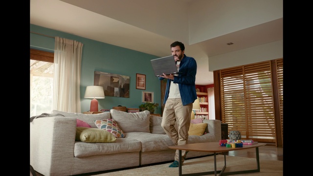 Video Reference: Couch, Furniture, Window, Comfort, Window blind, Picture frame, Building, Wood, Table, Living room