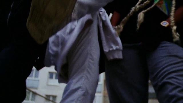 Video Reference: Sleeve, Gesture, Grey, Street fashion, Waist, Blazer, Sportswear, Formal wear, Denim, Human leg