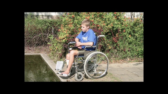 Video Reference: Wheelchair, Wheel, Plant, Tire, Bicycle tire, Bicycle accessory, Bicycle wheel, Motor vehicle, Grass, People in nature