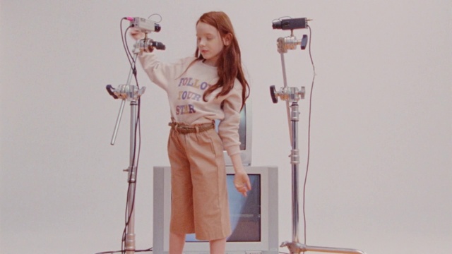 Video Reference: Microphone, Public address system, Sleeve, Standing, Dress, Musician, Audio equipment, Waist, Microphone stand, Thigh