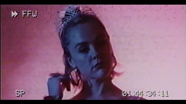 Video Reference: Eyelash, Purple, Violet, Font, Flash photography, Magenta, Electric blue, Darkness, Screenshot, Photo caption