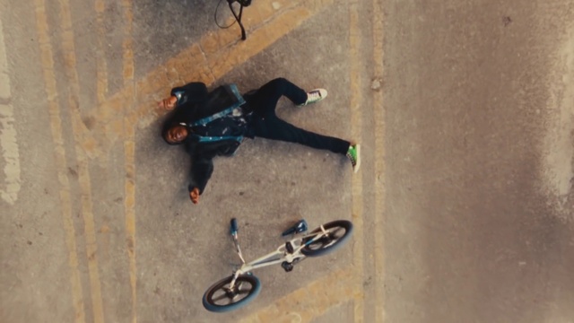 Video Reference: Wheel, Tire, Bicycle, Sports equipment, Bicycle wheel, Vehicle, Rolling, Stunt performer, Asphalt, Stunt