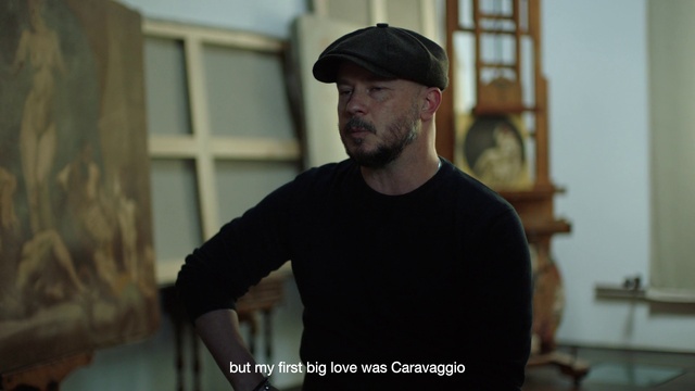 Video Reference: Flat cap, Beard, Cap, Sleeve, Flash photography, Baseball cap, Street fashion, Eyewear, Window, Facial hair