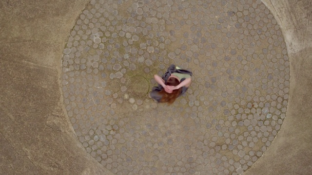 Video Reference: Leg, Road surface, Asphalt, Landscape, Sand, Circle, Foot, Flooring, Grass, Concrete