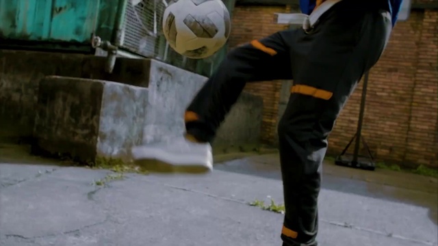 Video Reference: Sports equipment, Helmet, Headgear, Football, Ball, Asphalt, Road surface, Personal protective equipment, Glove, Flooring