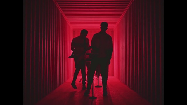 Video Reference: Entertainment, Line, Magenta, Art, Performing arts, Font, Suit, Event, Electric blue, Darkness